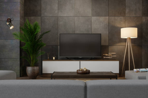 smart tv on cabinet in living room at night - man made structure high definition television domestic room living room photos et images de collection