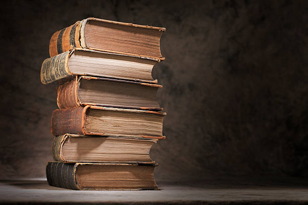 Old knowledge A Stack of old books. old book stock pictures, royalty-free photos & images