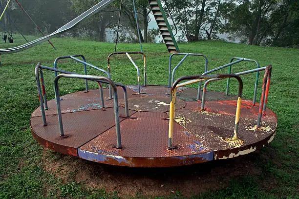 Photo of abandoned playground carousel