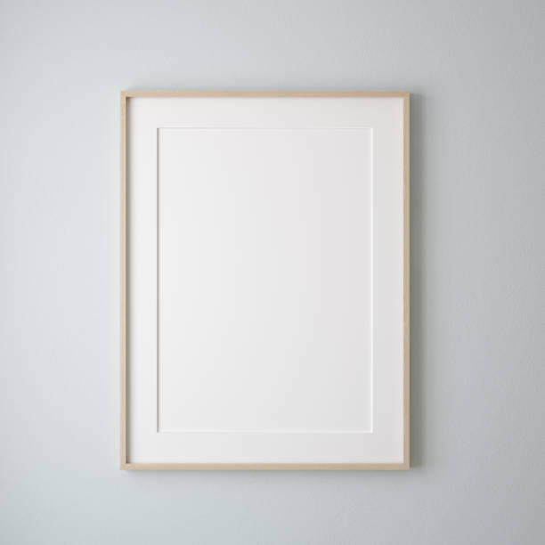 cornice poster mockup da vicino su parete dipinto colore blu pastello - poster blank wall picture frame foto e immagini stock