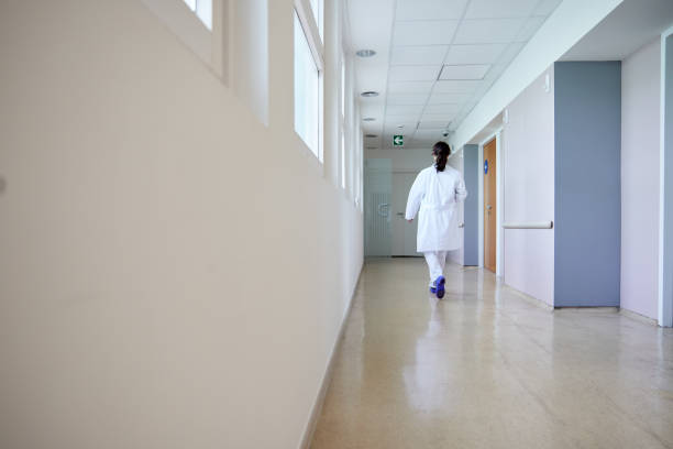 istock One female doctor walking on a  hospital corridor 1232336476