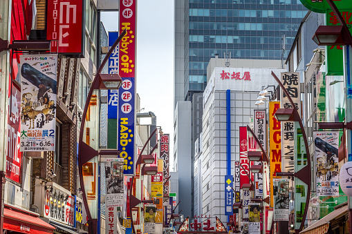 Tokyo, Japan - 21 April, 2019: Buildings and signs in the Shibuya area. The commercial and business center is famous or the nightlife area and its scramble crossing.