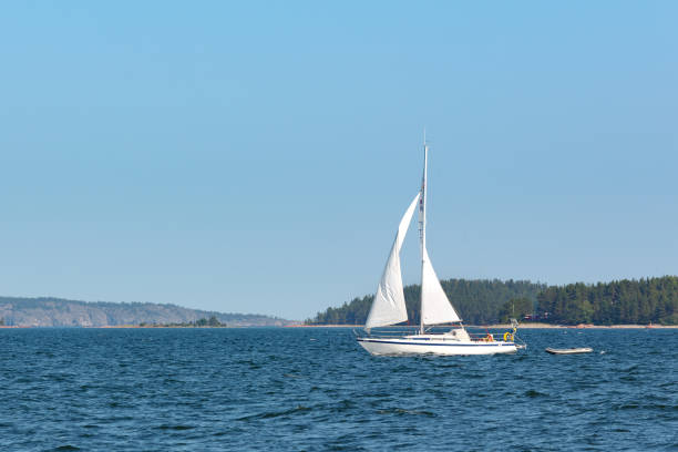 istock White boat on the blue lake 1232418446