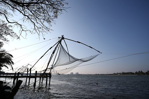 Kochi, India - 17th December 2016: Chinese fishing nets on the beach at Kochi Fort in Kochi, India.