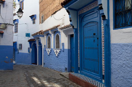 Chefchaouen, Morocco - April 8, 2019. Streets with houses and doors painted in blue