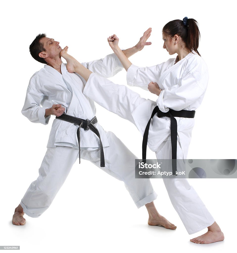 Karate Karate. Young girl and a men in a kimono with a white background. Battle sports capture Active Lifestyle Stock Photo