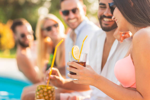 istock Friends having fun at poolside party 1232478945