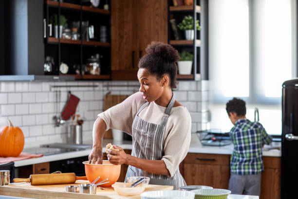 istock Mother with his son prepare pie in the kitchen 1232488635