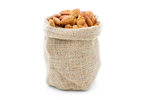 istock Almonds in a sack of cloth on a white background 1232491219
