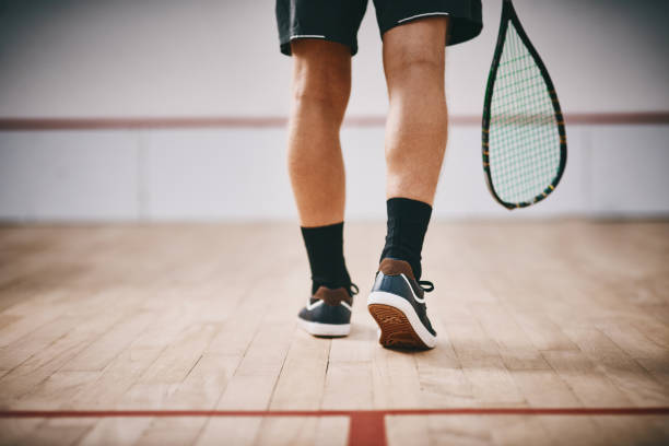 You've now entered the league of champions Cropped shot of an unrecognisable man playing a game of squash squash sport stock pictures, royalty-free photos & images