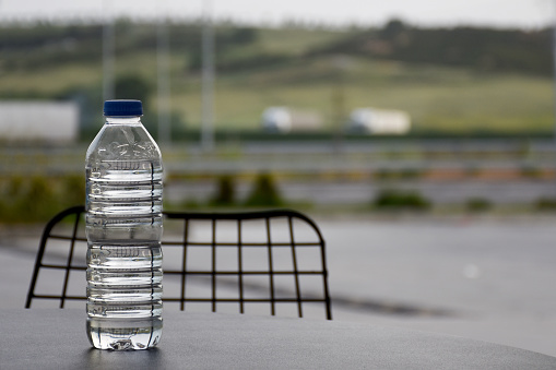 A plastic bottle of water on the cafe or restaurant table