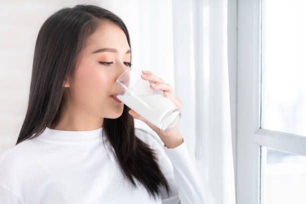 istock Young woman drink milk 1232587165