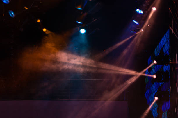 istock lights spotlights and smoke over the stage 1232592769