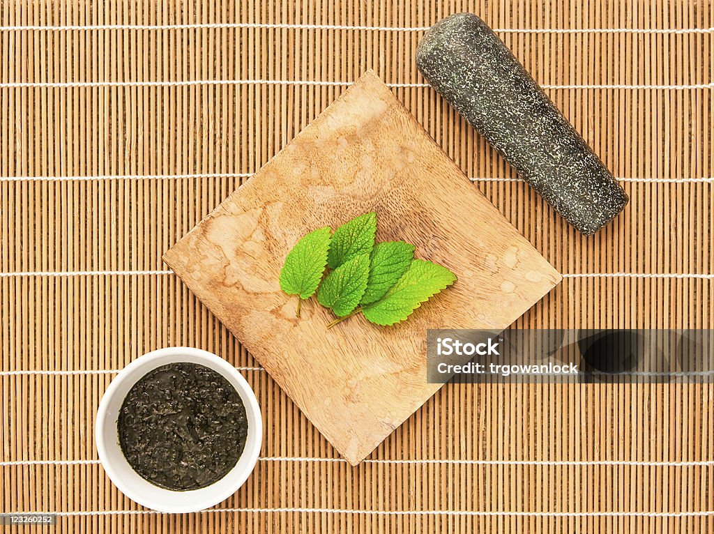 Mint sauce Mint leaves with a grinder and a bowl of mint sauce Bowl Stock Photo