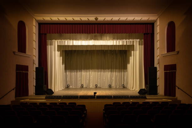 istock Theater lights spotlights and smoke over the stage 1232605048