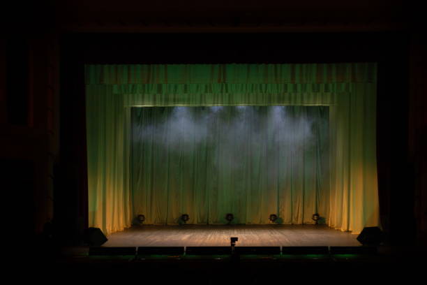 istock Theater lights spotlights and smoke over the stage 1232607088