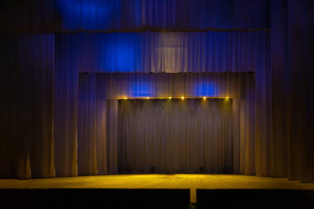 istock Theater lights spotlights and smoke over the stage 1232607123