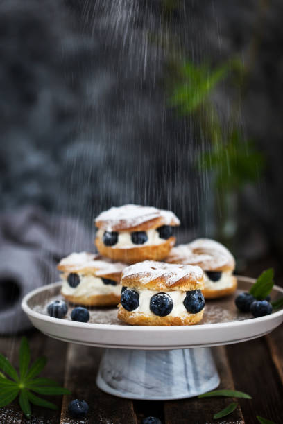 istock Cream puff rings (choux pastry) decorated with fresh blueberries 1232652784