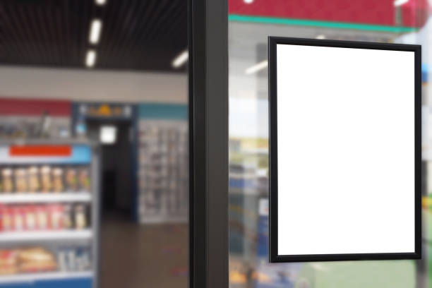 blank advertising billboard placard (clipping path) in the market window with blurred merket background - window display commercial sign blank nobody imagens e fotografias de stock