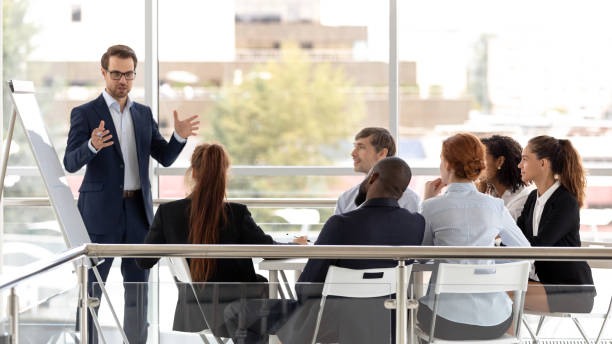 istock Successful coach businessman presenting new project to employee. 1232679950