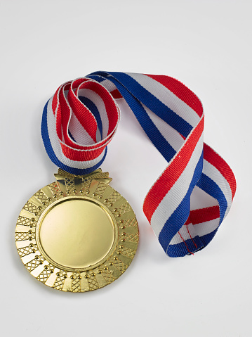 Medals awards for winner on wood background.