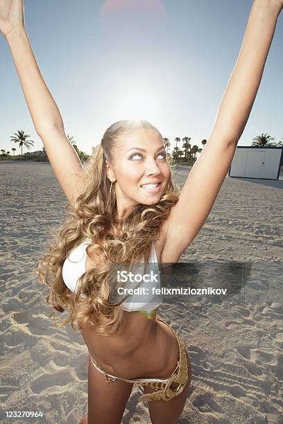 Woman On The Beach Stock Photo - Download Image Now - Adult, Adults Only, Arms Raised