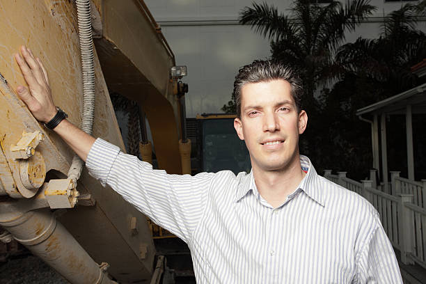 Businessman and construction crane