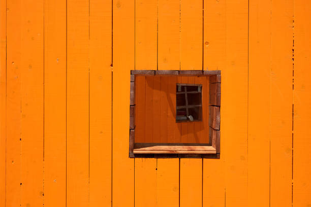 Orange abstract wooden background with square hole
