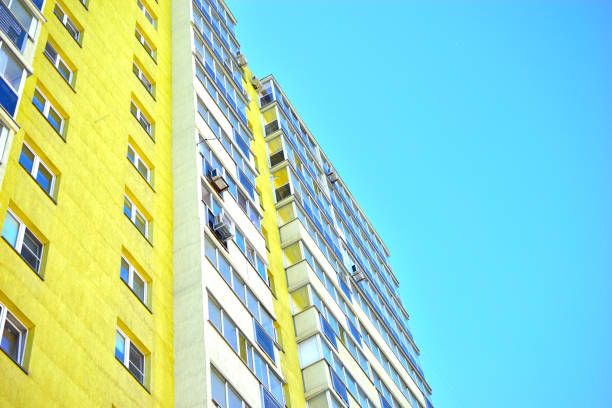 An unfinished skyscraper against the blue sky