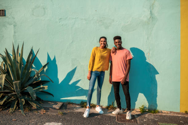 istock Portrait of two smiling couple looking at camera. 1232767515