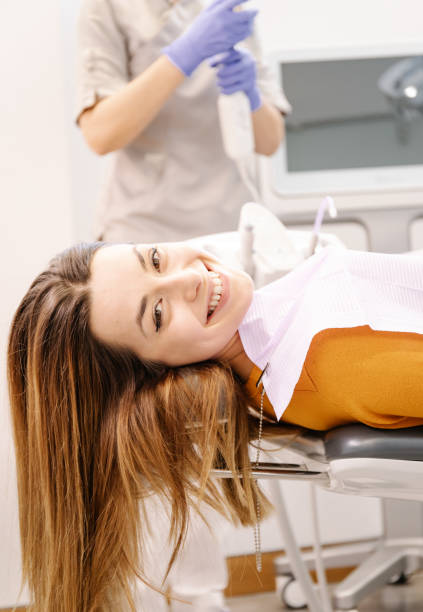 istock Young patient waits on the table looking at camera and smiling. 1232888019