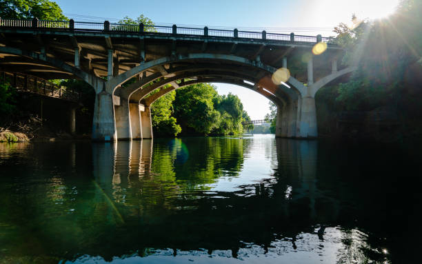 istock Sunburst Sunrise on Barton Creek at Barton Creek Bridge floating down the river 1232889332
