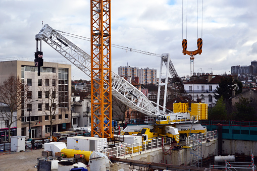 Accueil-Cachan, France - January 13th 2019 : crane Liebherr LG 1750, used for a construction site for extending the underground line 15. This crane is one of the biggest of the world, and can carry 75 tons.