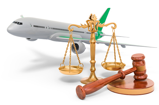 Aeroplane with wooden gavel and scales of justice. 3D rendering isolated on white background