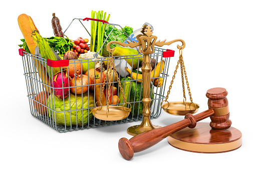 Consumer protection concept. Shopping basket full of products with wooden gavel and scales of justice. 3D rendering isolated on white background