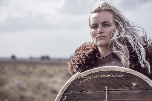 An individual viking female warrior outdoors