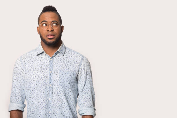 istock Thoughtful African American man looking aside at copy space 1232986396