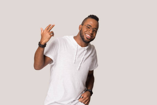 istock Smiling African American man moving, having fun, making funny gesture 1232986719