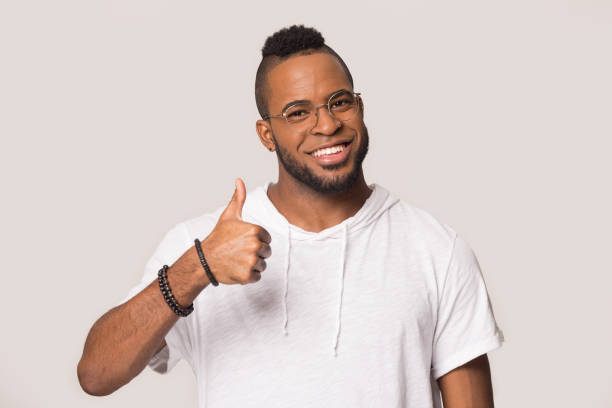 istock Happy African American man showing thumbs up gesture, satisfied client 1232986730