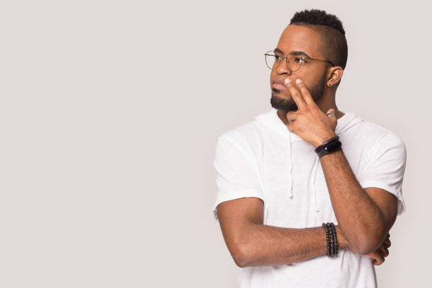 istock Thoughtful African American man looking aside at copy space 1232986733