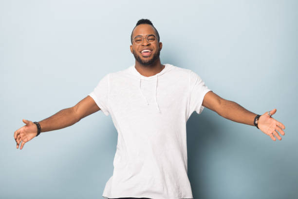 istock Happy friendly African American man raising hands, offering hugs 1232987247