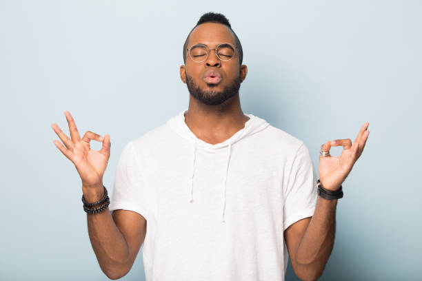 istock Thoughtful African American man practicing yoga with closed eyes 1232987251