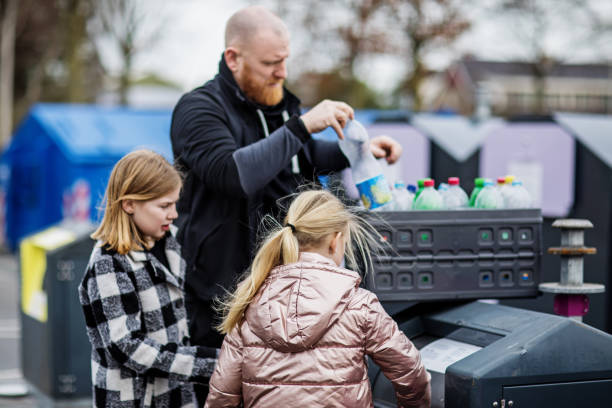 istock Family recycling plastic bottles 1233030617