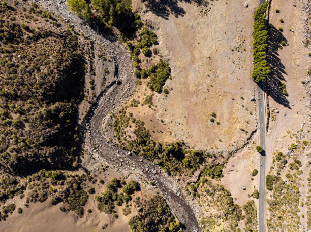 istock Road running beside a river in Cajon del Maipo 1233031136