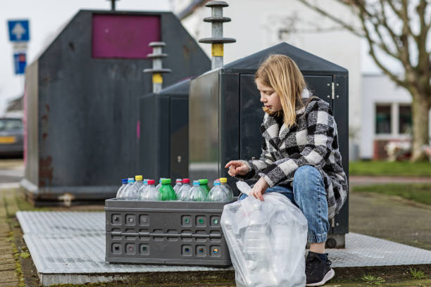istock Young girl at a plastic recycling centre 1233031650