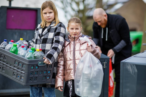 istock Family recycling plastic bottles 1233039426