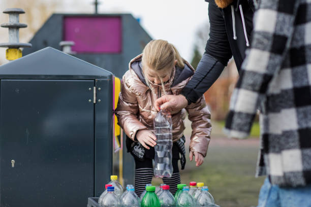 istock Family recycling plastic bottles 1233040459