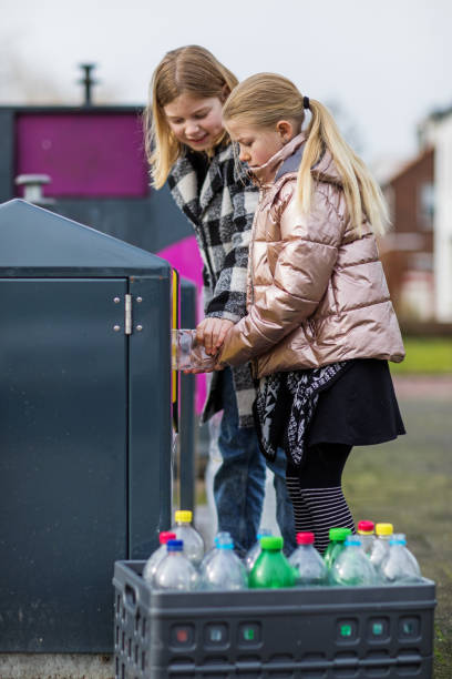 istock Young girls at a plastic recycling centre 1233040976