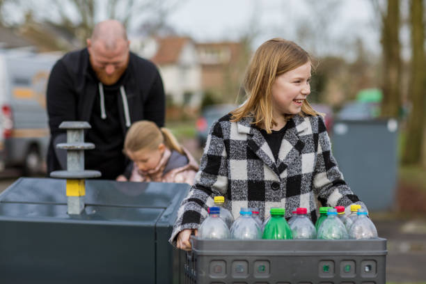 istock Family recycling plastic bottles 1233042511