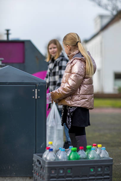 istock Young girls at a plastic recycling centre 1233042516